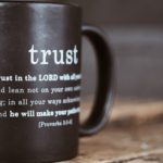 black mug with proverb from holy bible